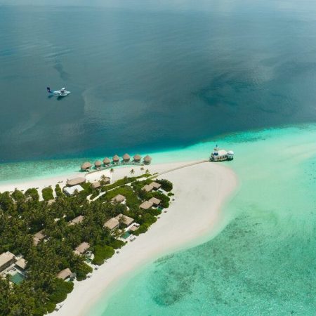 Breathtaking aerial views showcase its luxurious setting amidst the azure waters of the Indian Ocean.